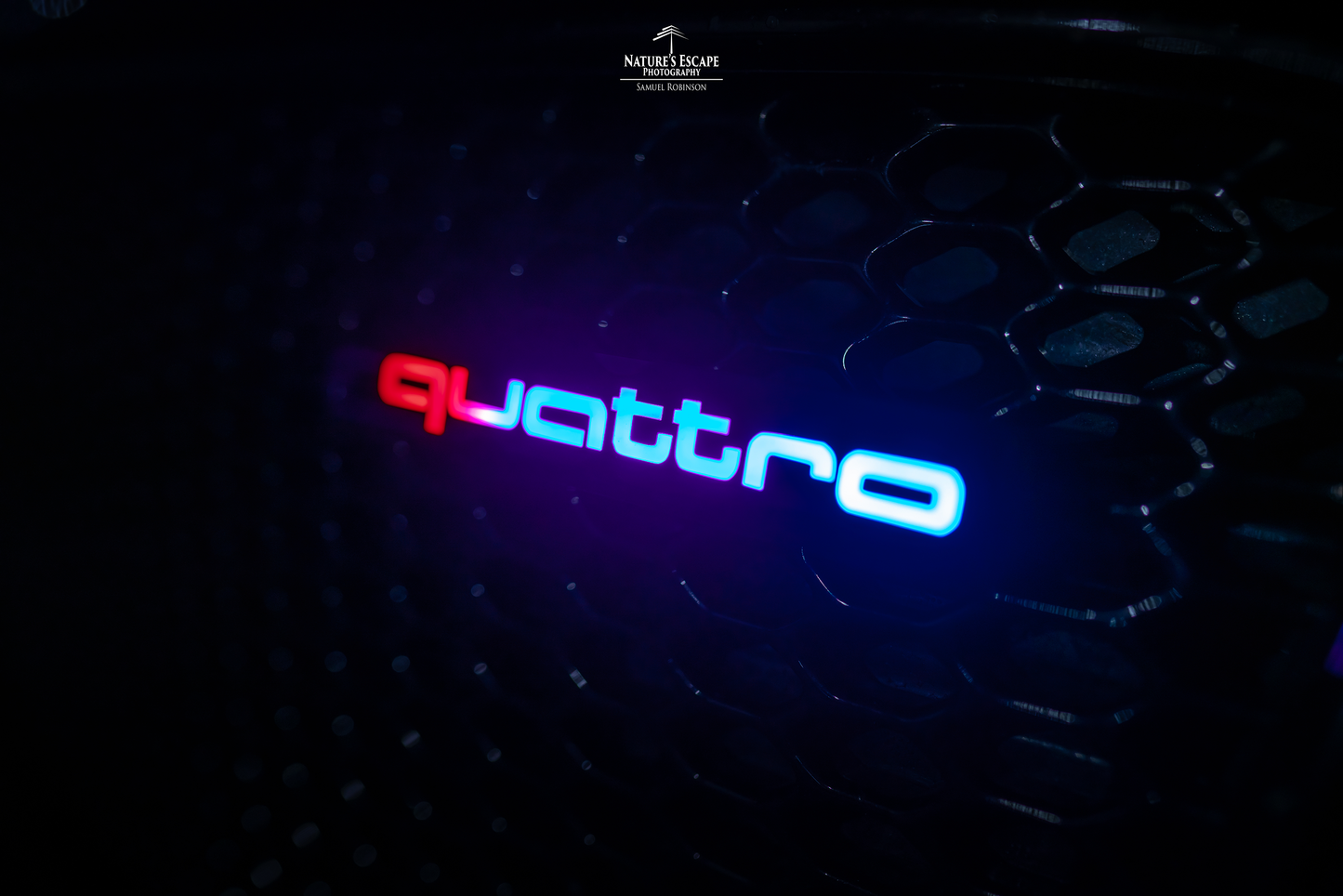 Lit Logos Quattro Badge